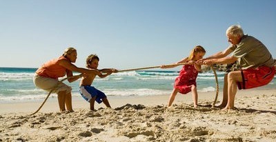older and younger people on beach playing.jpg